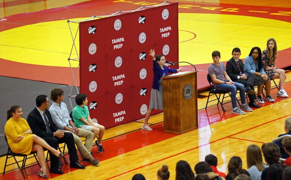 Declamations middle school winner speaks in front of assembly