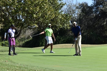 Team putting at Tampa Prep Golf Outing