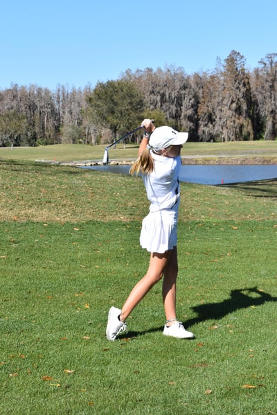 Young girl swinging her club at Saddlebrook Resort for Tampa Prep Golf Outing